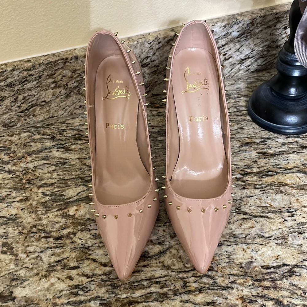 Red bottom, nude heels with gold spikes